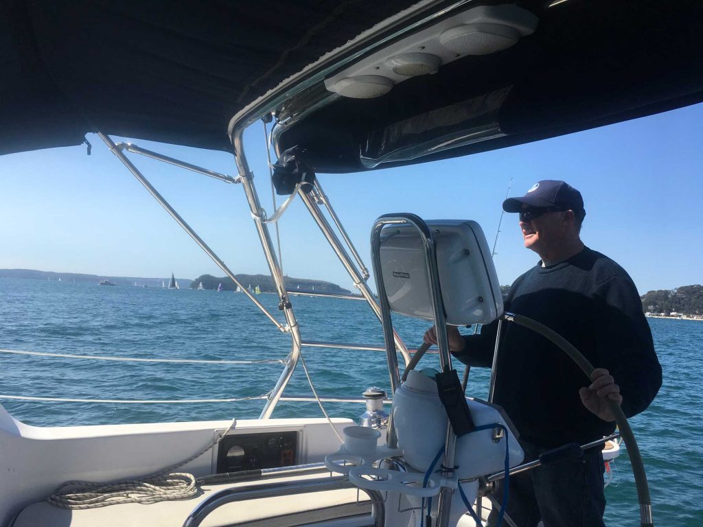 At the helm off The Basin, Pittwater