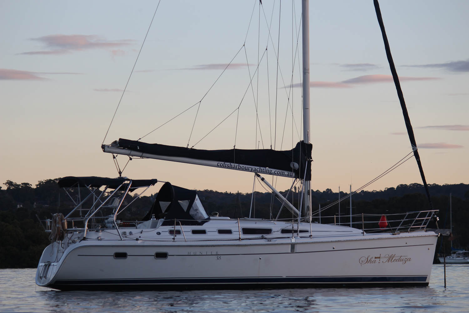 The Hunter 38 Sha Meduza on calm water at sunset