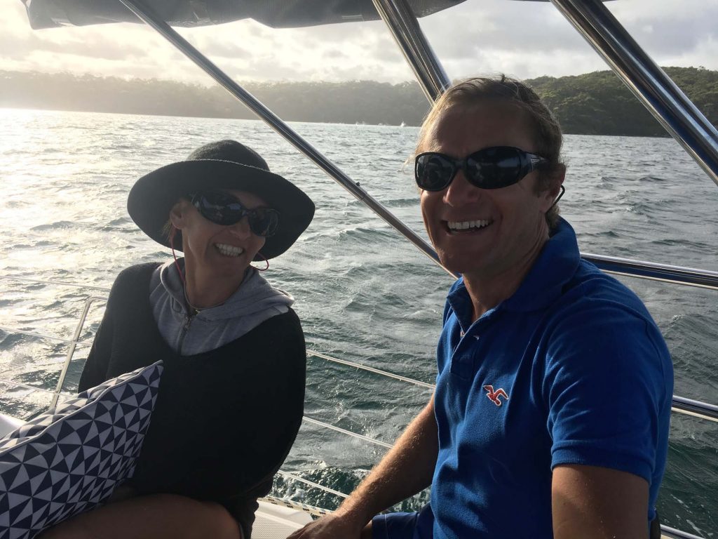 Guests at the stern of Sha Meduza on Pittwater