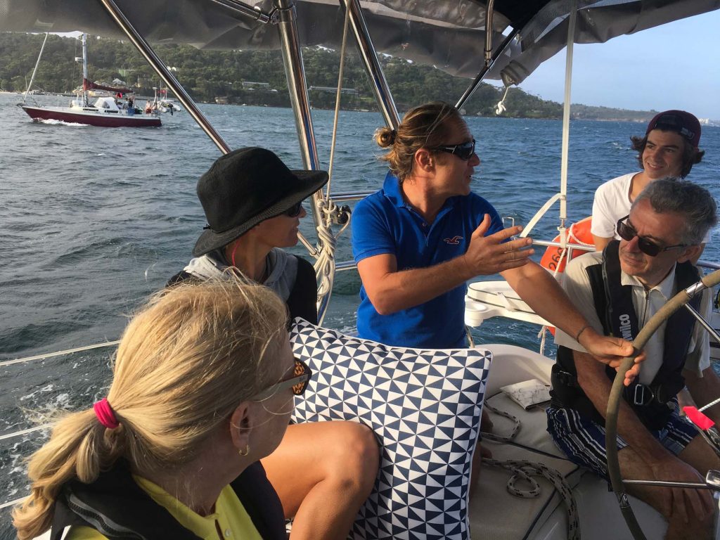 Guests sitting together on board during a Pittwater charter