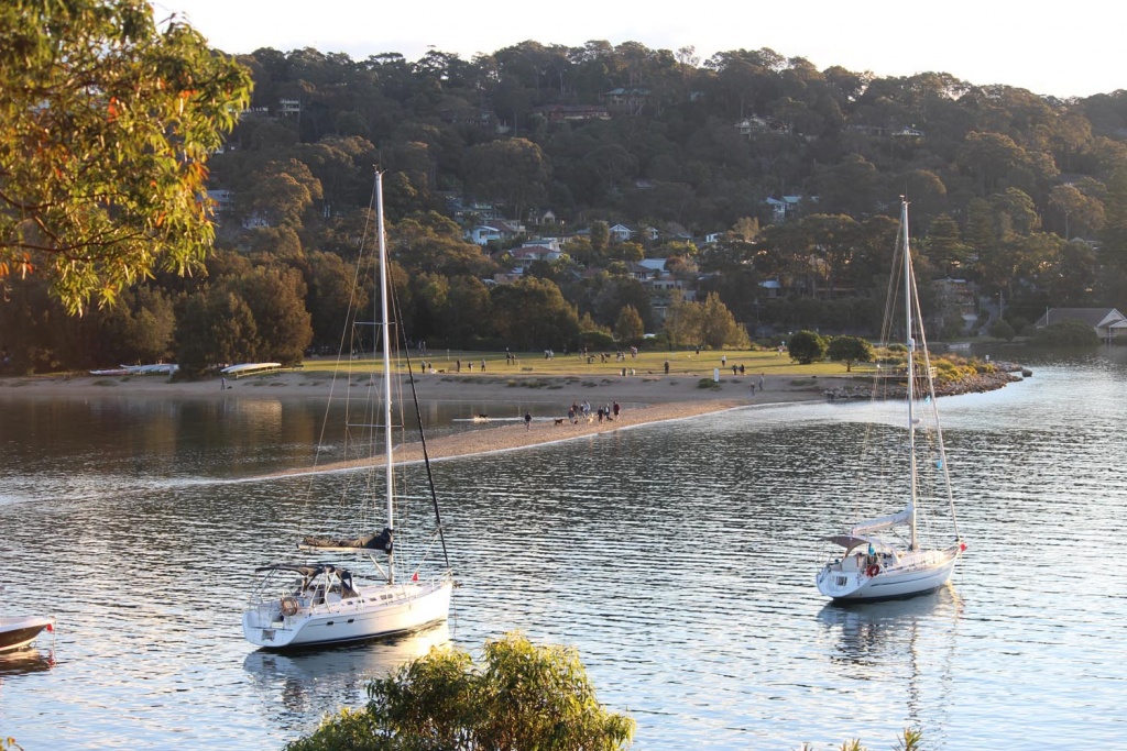 Yachts moored along the shoreline near The Basin